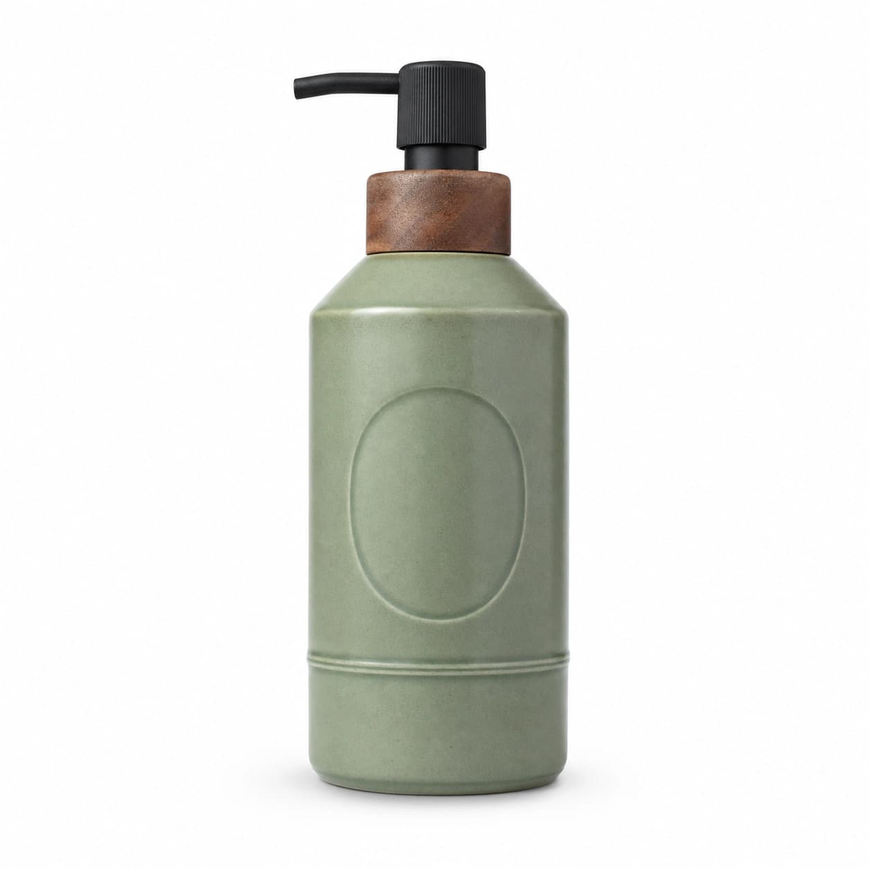 Reference photograph of a sage-green ceramic pump bottle with a walnut collar and black ribbed pump, shot straight on against a plain white studio background
