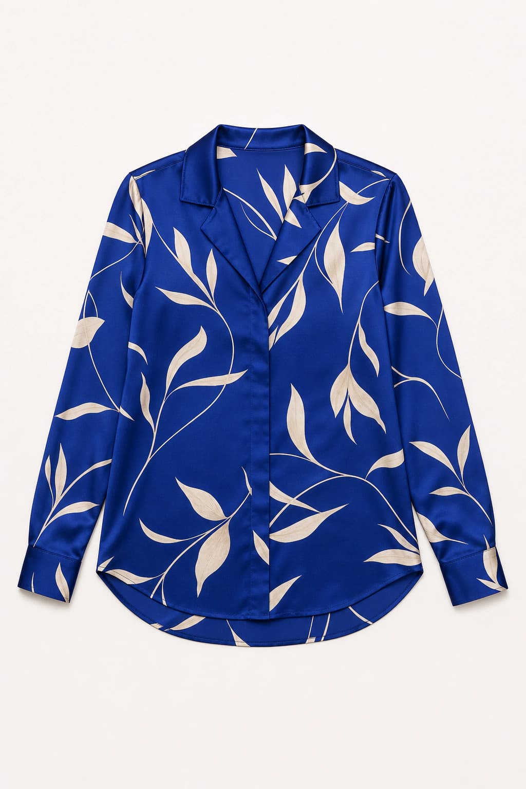 Cobalt-blue botanical blouse photographed flat