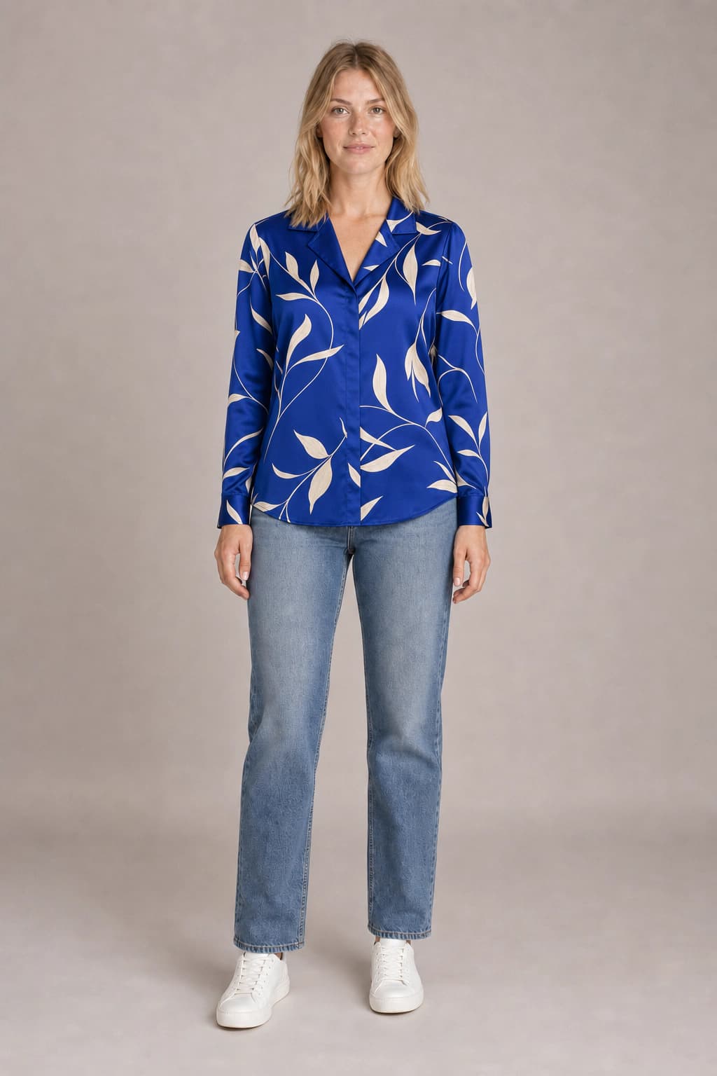 Studio virtual try-on preview of the cobalt blouse on the default blonde model