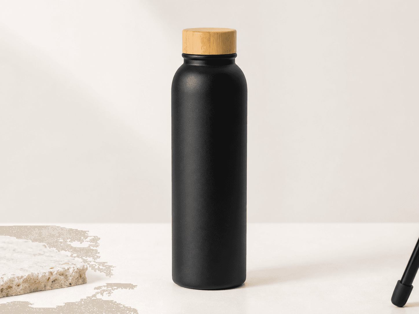 Close view of the preserved bamboo cap and matte black bottle